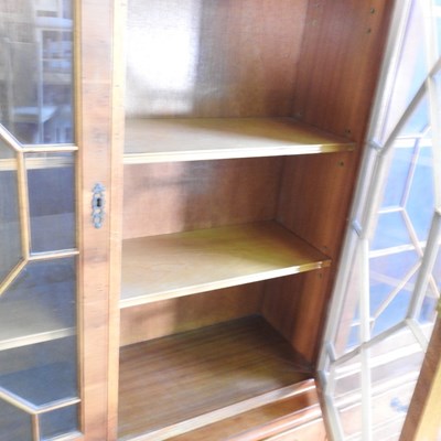 Lot 805 - A reproduction yew wood bookcase, on a plinth...