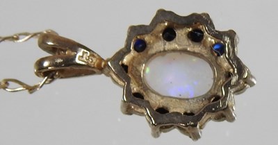 Lot 162 - A 9 carat gold opal and sapphire pendant...