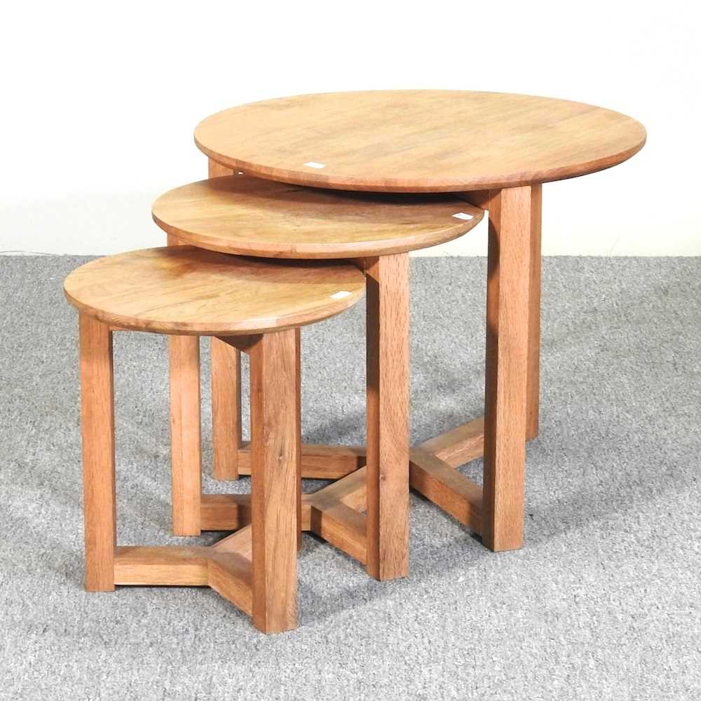 Lot 73 - A nest of three circular contemporary oak side...
