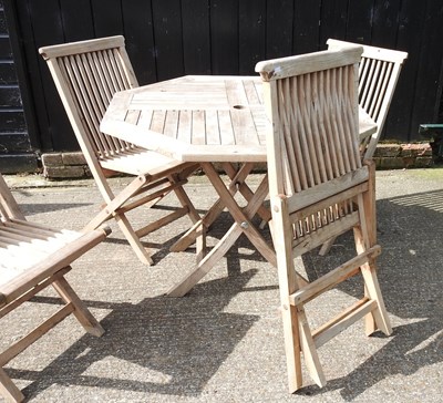 Lot 1 - A teak folding garden table, 99cm diameter,...