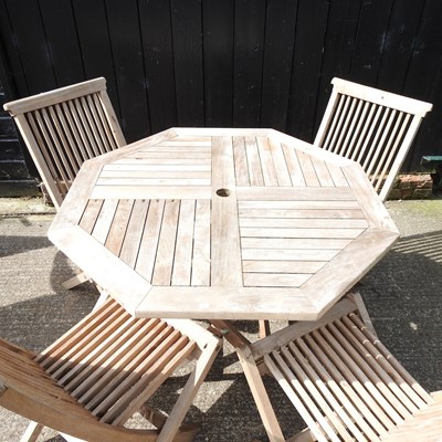 Lot 1 - A teak folding garden table, 99cm diameter,...