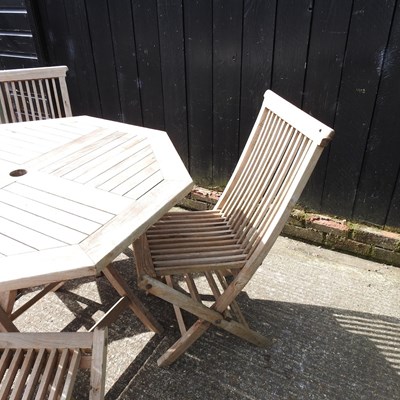 Lot 1 - A teak folding garden table, 99cm diameter,...