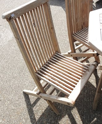 Lot 1 - A teak folding garden table, 99cm diameter,...