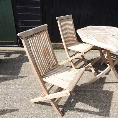 Lot 1 - A teak folding garden table, 99cm diameter,...