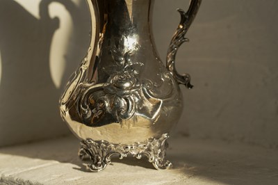 Lot 43 - A Victorian silver jug, repousse decorated...