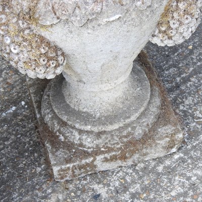 Lot 8 - A pair of weathered cast stone garden urns,...
