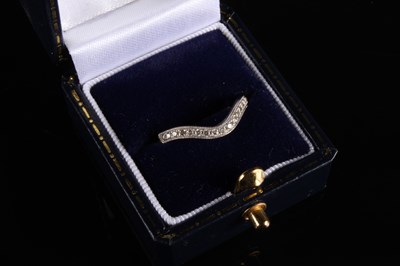 Lot 57 - An 18 carat gold and diamond dress ring, of...