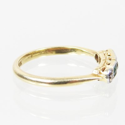 Lot 38 - A gold and platinum set five stone emerald and...