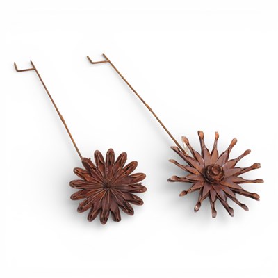Lot 684 - Two rusted metal garden flower head plant...