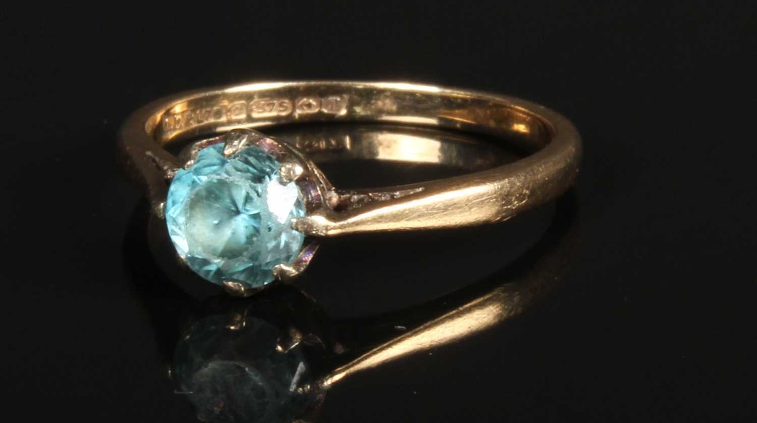 Lot 49 - A 9 carat yellow gold blue gem set dress ring, Lot 49 - A 9 carat yellow gold blue gem set dress ring,