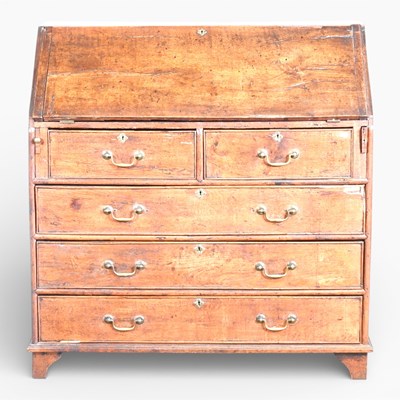 Lot 416 - A George III oak bureau, on bracket feet,...