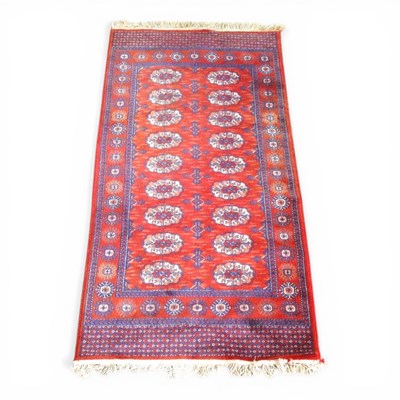 Lot 587 - A Hamadan rug, with two rows of medallions, on...