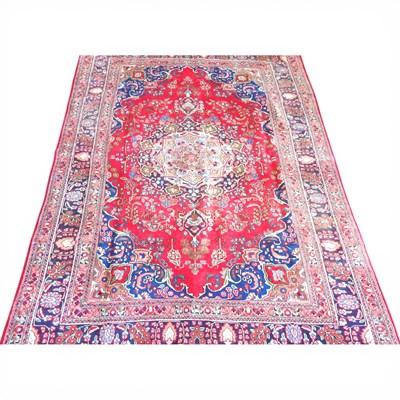 Lot 673 - A Persian kashan carpet, having a large...