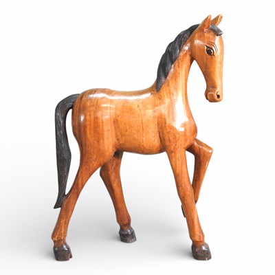 Lot 564 - A large hardwood figure of horse, 102cm high