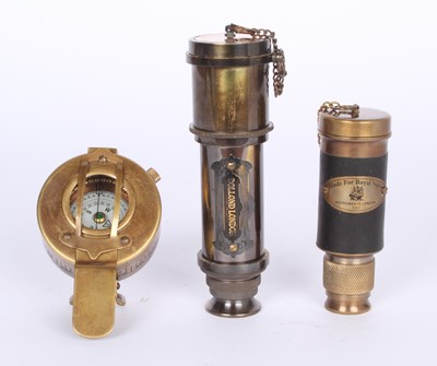Lot 218 - A brass military compass, and two small...