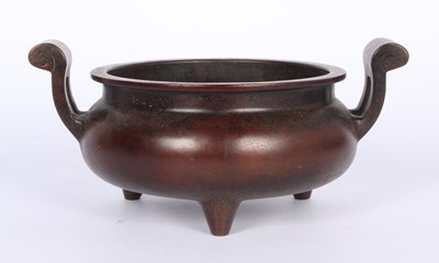 Lot 114 - A Chinese bronze censor, flanked by twin handles