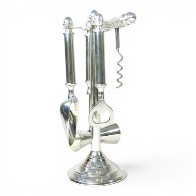 Lot 495 - A plated bar tool set, including a bottle...