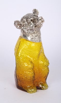 Lot 174 - An plated metal and yellow glass claret jug,...