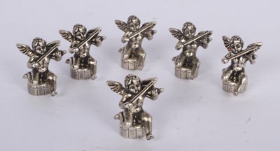 Lot 86 - A set of six plated metal cherub menu holders