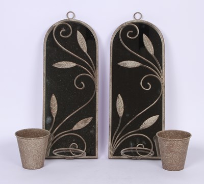 Lot 624 - A pair of garden mirrors, with a hanging plant...