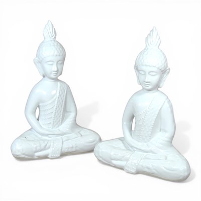 Lot 491 - A pair of white porcelain models of seated...