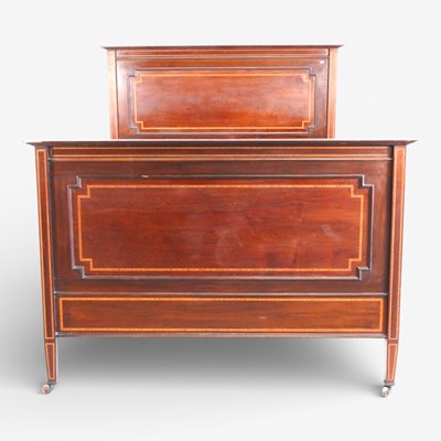 Lot 605 - An Edwardian mahogany bedstead, with satinwood...