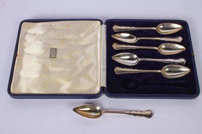Lot 58 - A set of six George V silver spoons, London...