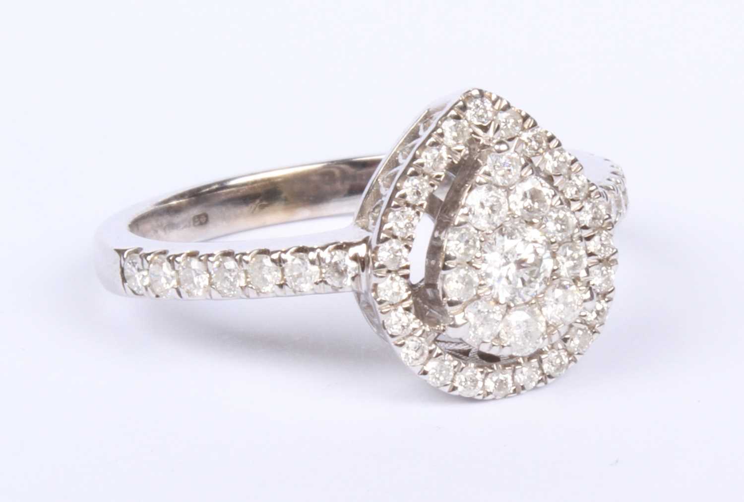Lot 16 - A 9 carat white gold pear shaped diamond...