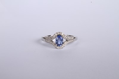Lot 24 - An 18 carat white gold tanzanite and diamond...
