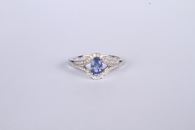 Lot 24 - An 18 carat white gold tanzanite and diamond...