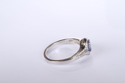 Lot 24 - An 18 carat white gold tanzanite and diamond...