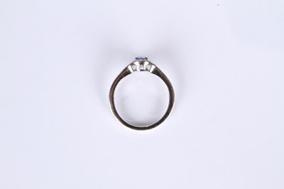 Lot 24 - An 18 carat white gold tanzanite and diamond...