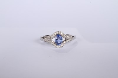 Lot 24 - An 18 carat white gold tanzanite and diamond...