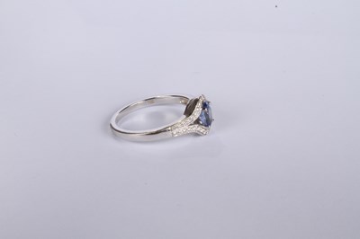 Lot 24 - An 18 carat white gold tanzanite and diamond...