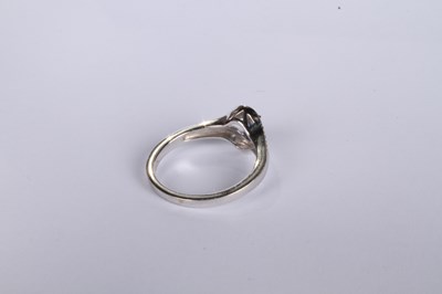Lot 24 - An 18 carat white gold tanzanite and diamond...