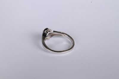 Lot 24 - An 18 carat white gold tanzanite and diamond...