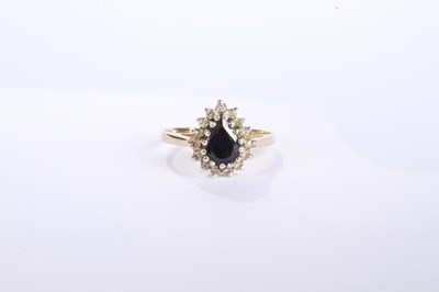 Lot 12 - A 9 carat yellow gold pear shaped sapphire and...