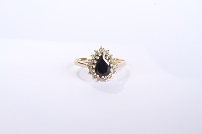 Lot 12 - A 9 carat yellow gold pear shaped sapphire and...