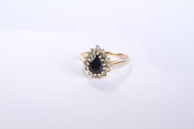 Lot 12 - A 9 carat yellow gold pear shaped sapphire and...