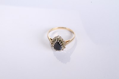 Lot 12 - A 9 carat yellow gold pear shaped sapphire and...