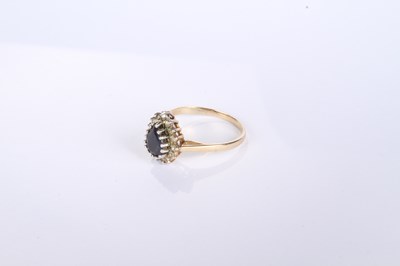 Lot 12 - A 9 carat yellow gold pear shaped sapphire and...