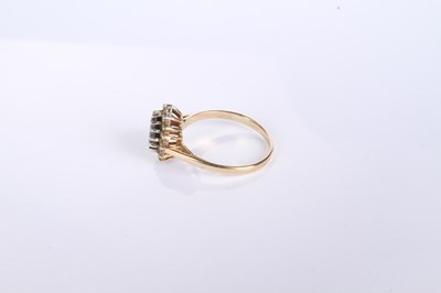 Lot 12 - A 9 carat yellow gold pear shaped sapphire and...
