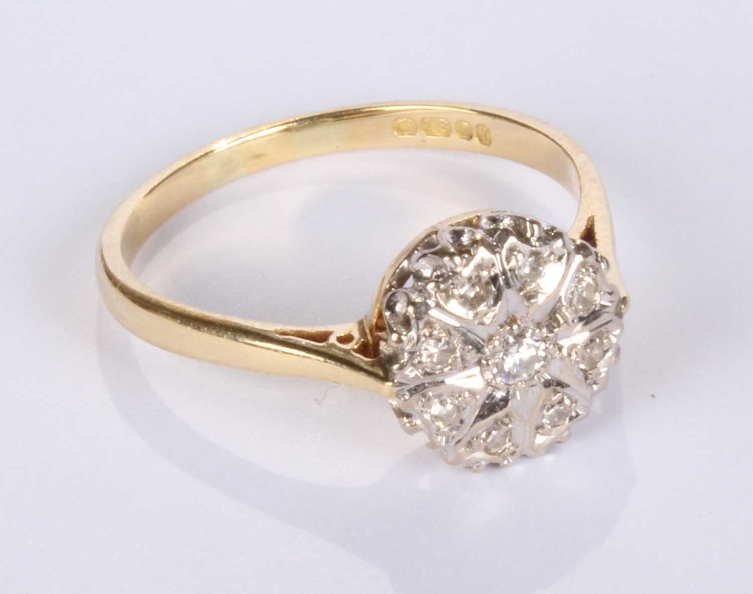Lot 20 - An 18 carat yellow gold diamond cluster ring,...