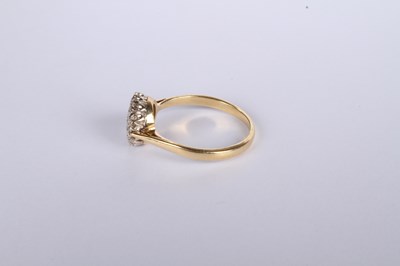 Lot 20 - An 18 carat yellow gold diamond cluster ring,...