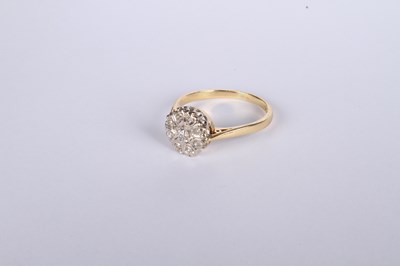 Lot 20 - An 18 carat yellow gold diamond cluster ring,...