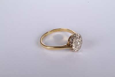 Lot 20 - An 18 carat yellow gold diamond cluster ring,...