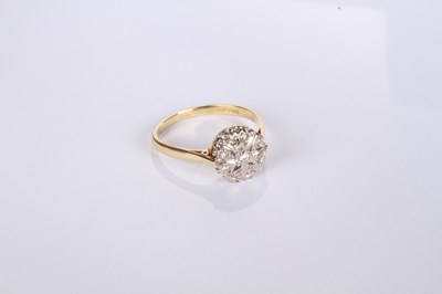 Lot 20 - An 18 carat yellow gold diamond cluster ring,...