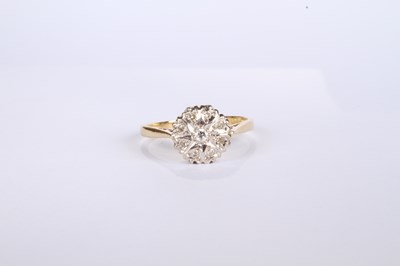 Lot 20 - An 18 carat yellow gold diamond cluster ring,...