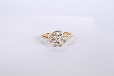 Lot 20 - An 18 carat yellow gold diamond cluster ring,...