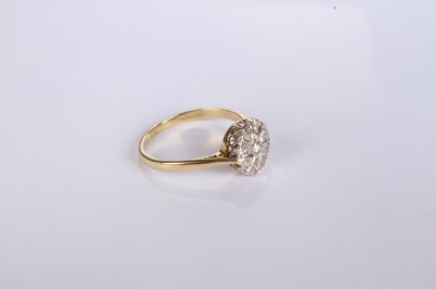 Lot 20 - An 18 carat yellow gold diamond cluster ring,...